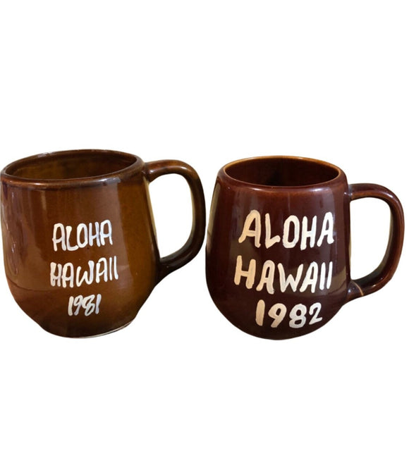 Vintage Home Decor Early 80s Lot Of 2 Hawaiian Souvenir Tiki Chocolate Brown Glaze Coffee Mugs Dated 1981 & 82.